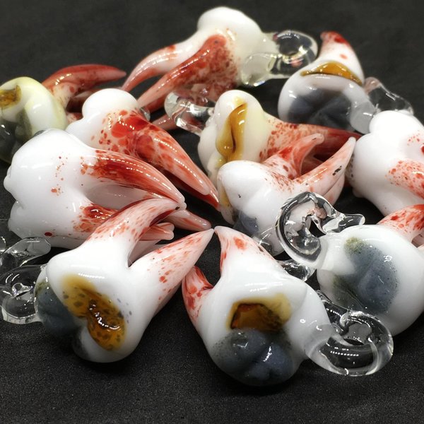 Pulled tooth pendant
