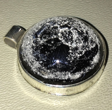 Black Cremain pendant set in Sterling